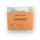 Handcrafted Ocean Breeze Goat Milk soap bar with notes of fresh sea salt, and sandalwood, with soothing blue hues