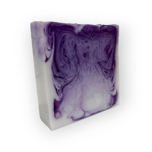 Handcrafted Sea Salt and Orchid Goat Milk soap bar with notes of sea salt and freesia, with purple and white swirls.