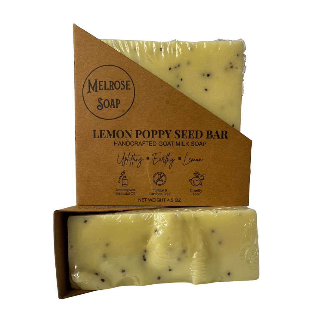 Two Lemon Poppy Seed handcrafted goat milk soap bars stacked on top of each other by Melrose Soap. Labeled with uplifting lemongrass scent, sulfate-free and cruelty-free, approx. 4.5 oz.